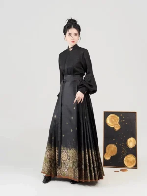 Front view of black jacquard Chinese Hanfu blouse and gold motif Ming style mamian skirt