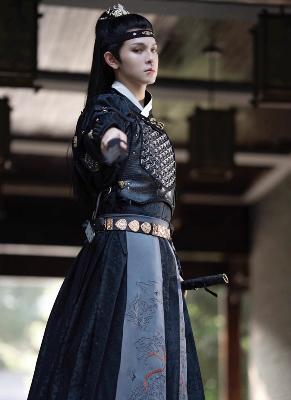 Black and gray blue fantasy general hanfu costume with embroidered skirt, shoulder armor, gold round waist belt, and martial arts pose