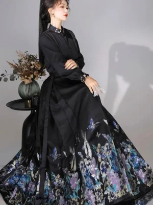 Right side view of a black Chinese Hanfu outfit featuring a pleated mamianqun horse face skirt with bird flower butterfly embroidery and matching waist sash
