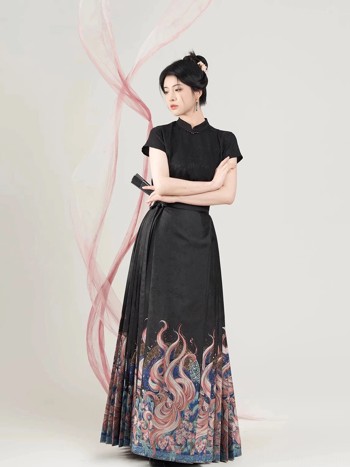 Front view of fitted black jacquard Hanfu blouse and high-waisted pleated mamian skirt with fox-inspired hem artwork