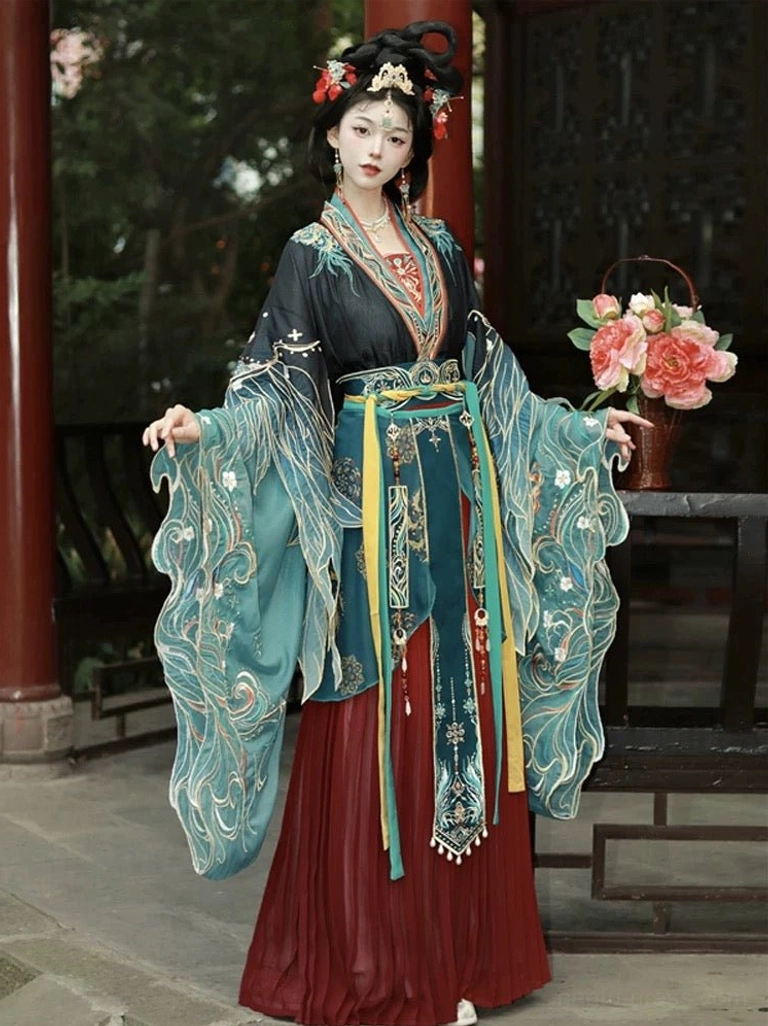 Black and maroon Wei Jin Dynasty Hanfu dress with teal embroidered sleeves and a flowing yellow sheer scarf displayed in a traditional Chinese pavilion courtyard