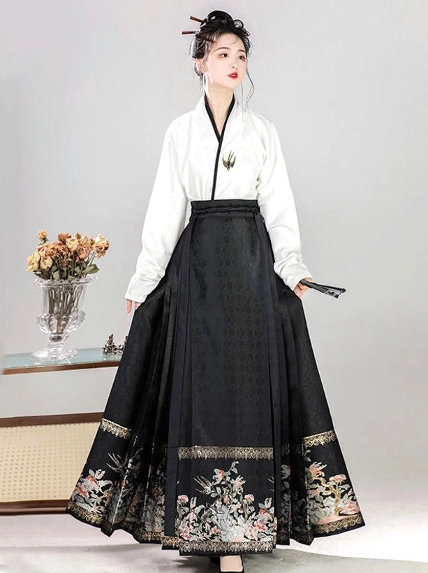 Black Ming Dynasty Hanfu set featuring a white embroidered cross-collar top and floral hem mamianqun skirt