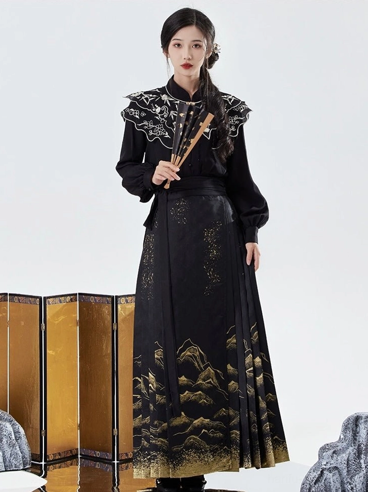 Front full length view of black Ming Dynasty inspired Hanfu with pleated gold mountain mamianqun horse face skirt