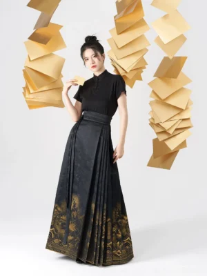 Black Ming-inspired Hanfu blouse and golden epiphyllum mamian skirt outfit shown in a three-quarter full-body studio portrait