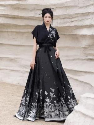 Full-body view of a black Ming-inspired Hanfu Mamianqun outfit with silver floral butterfly and traditional architecture embroidery