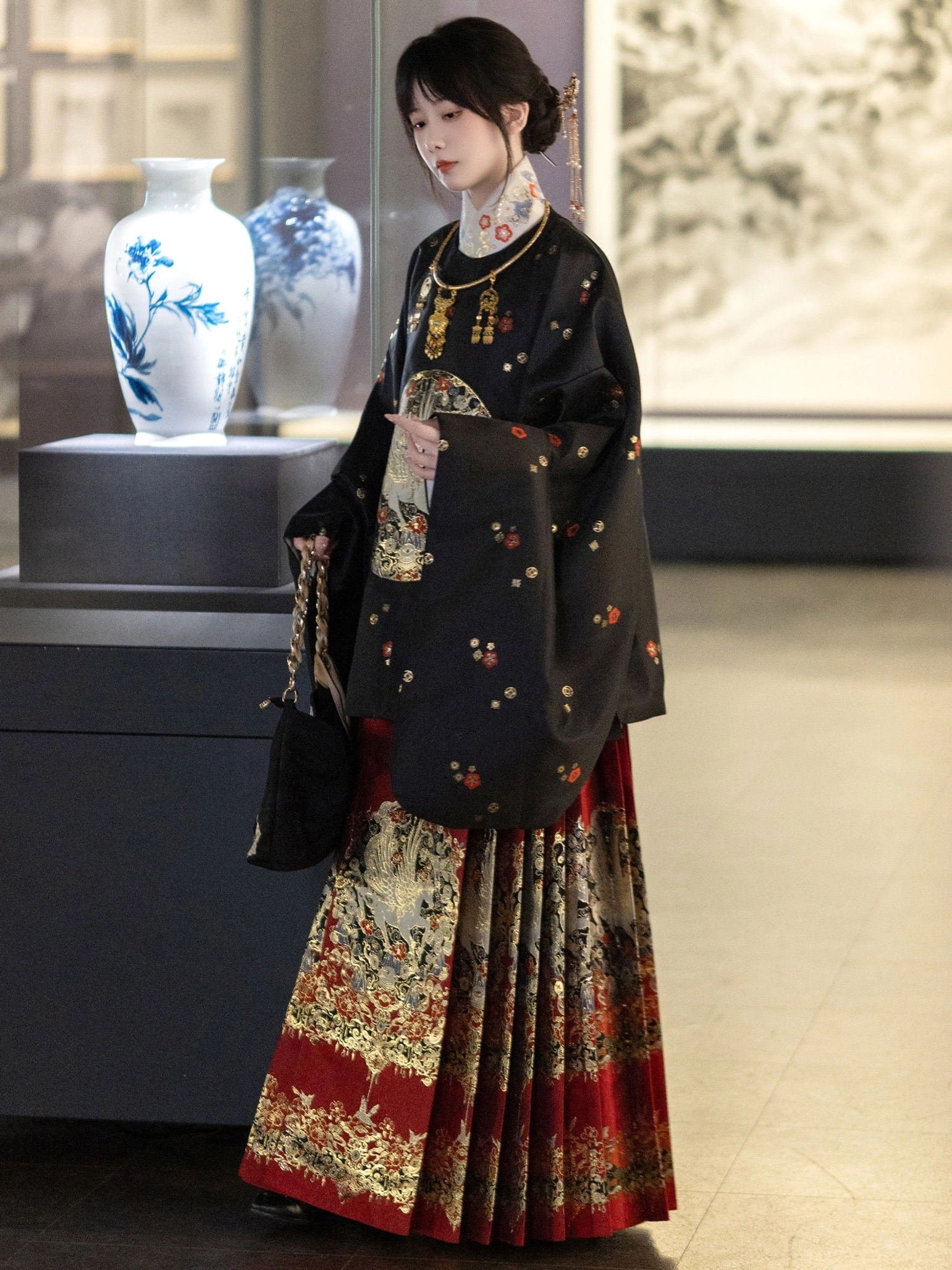 Black Ming-inspired round-collar Hanfu top with silver crane chest medallion and subtle floral pattern