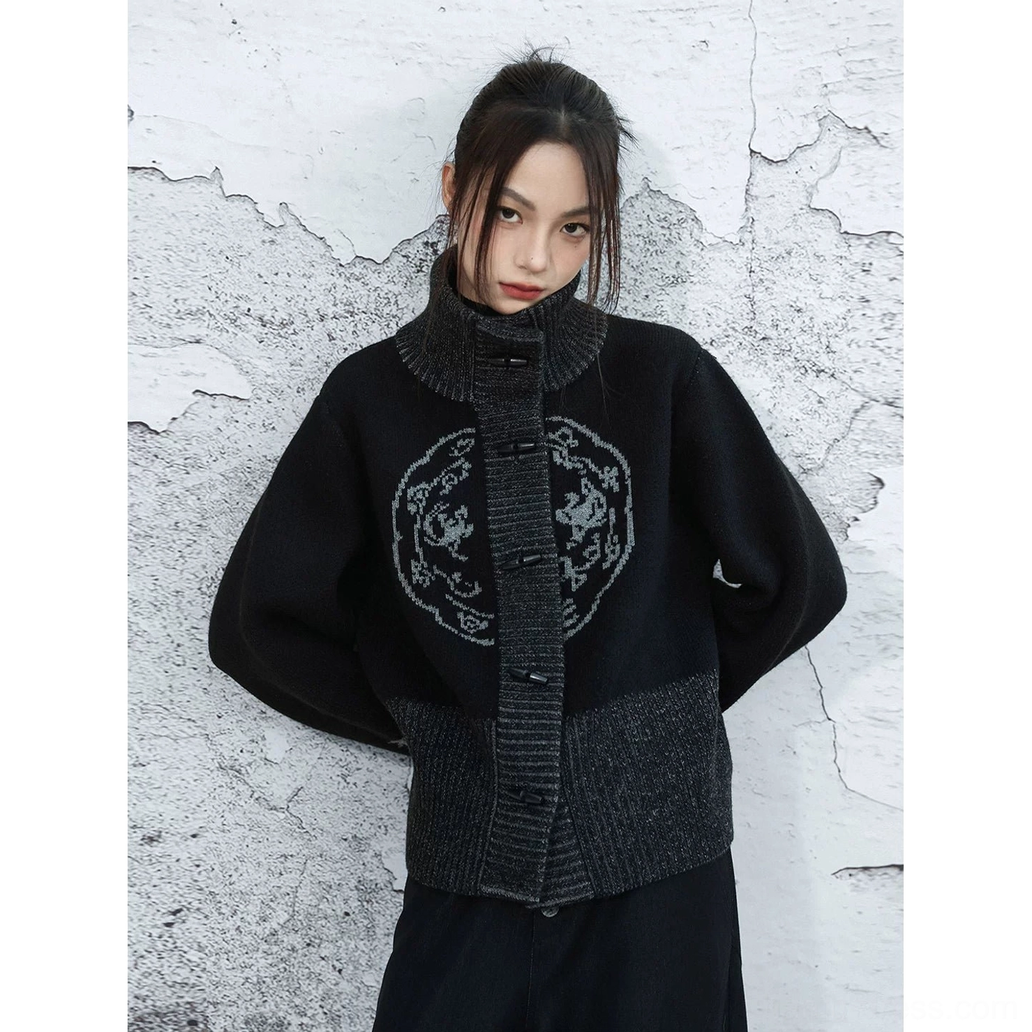 Front close-up of black Modern Hanfu stand collar knit cardigan featuring Chinese frog button closure and circular chest motif