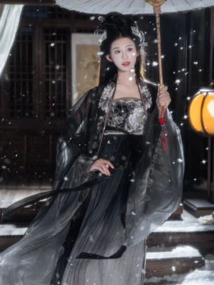 Black Peony Tang style Hanfu Heziqun complete set worn standing with a white oil-paper umbrella, showing layered dark robes and traditional Chinese hairstyle