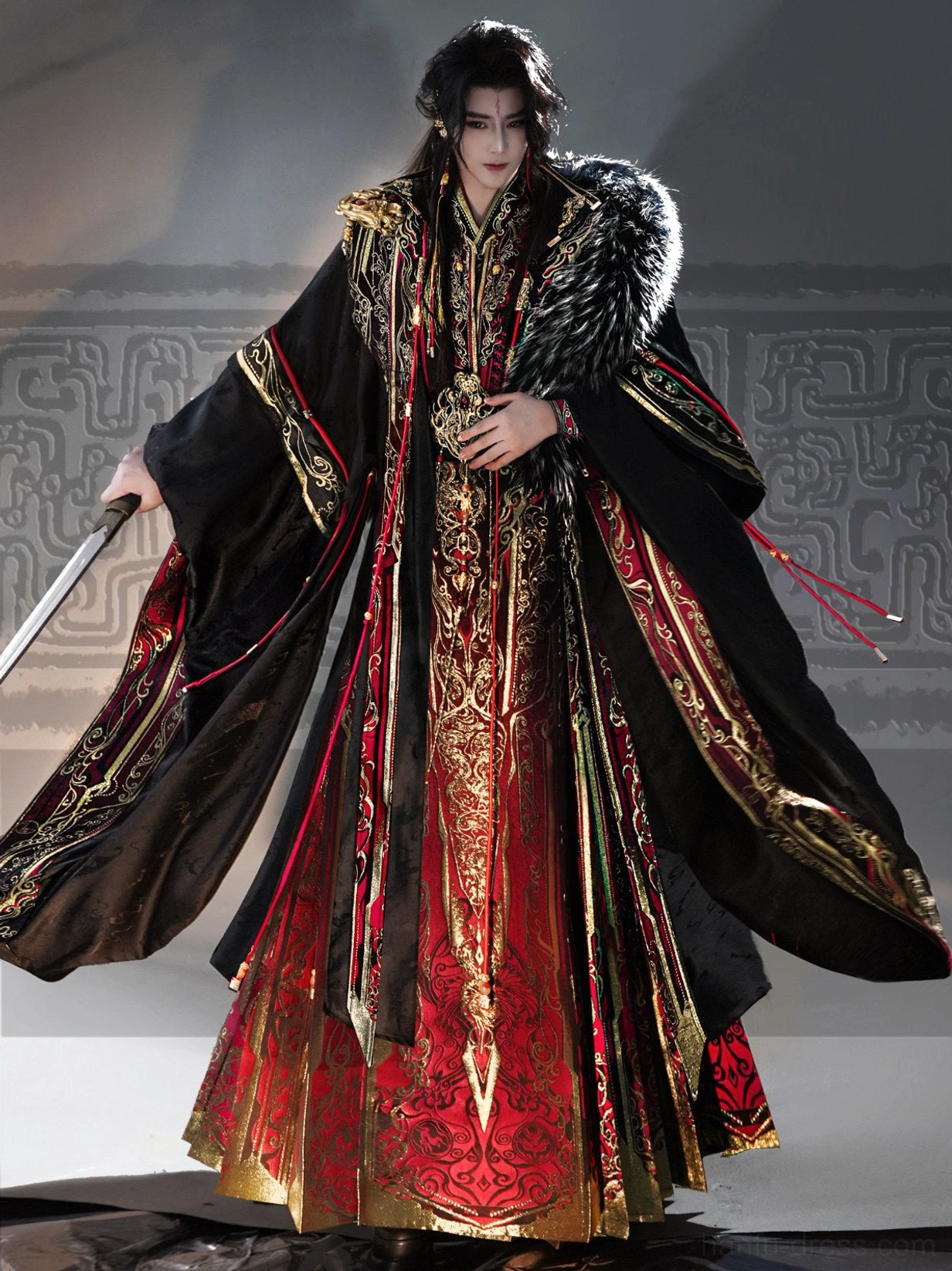 Three quarter view of black and red men's hanfu for men with open flowing cloak, gold trim, embroidered inner robe, and red tassels