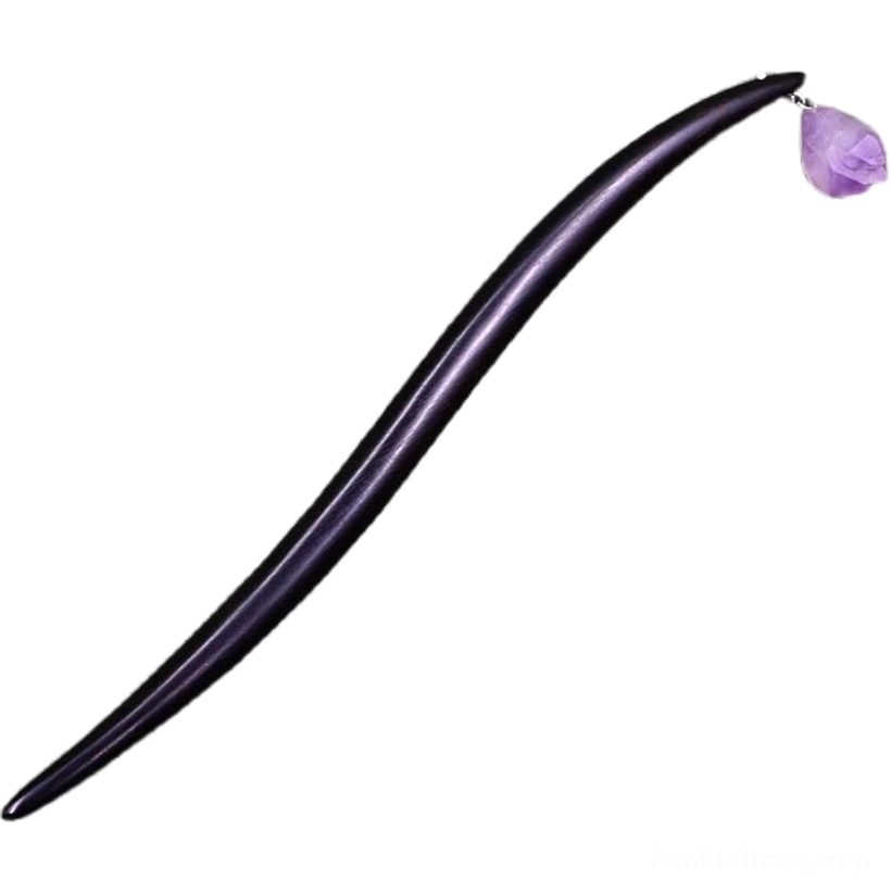 Full flat lay view of curved black sandalwood Chinese hair stick with irregular natural purple amethyst pendant