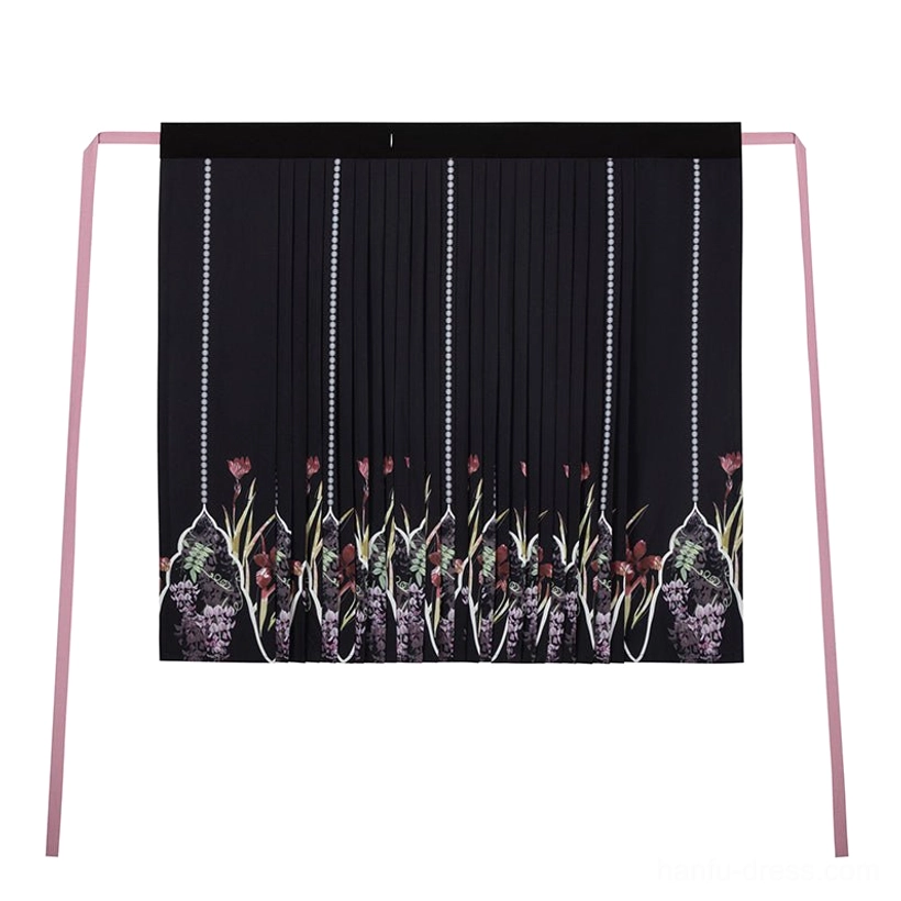 Black Song Dynasty Hanfu pleated skirt shown flat with floral botanical prints along the hem and long pink waist sash ties
