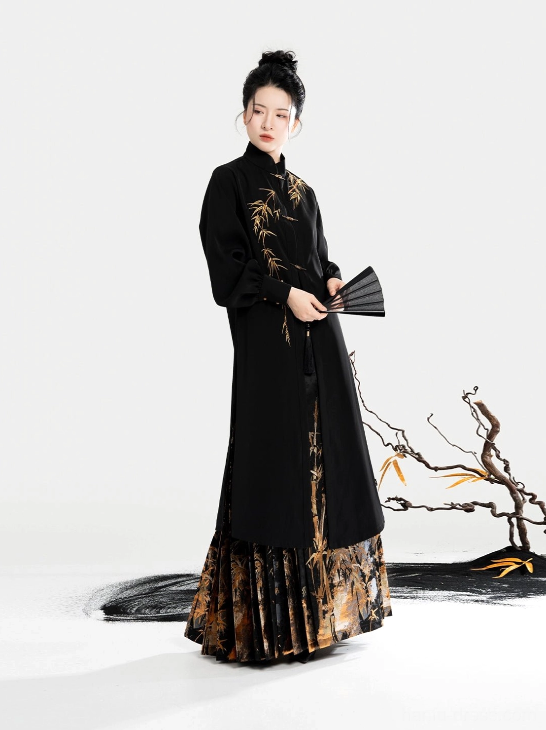 Black Chinese stand-collar blouse with lantern sleeves metal frog fasteners and golden bamboo chest detail