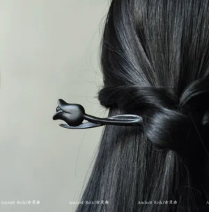 Side back view of a black tulip wooden hair stick securing straight long hair in an elegant half-up Hanfu-inspired hairstyle