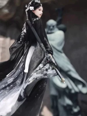 Back three-quarter view of black Wei Jin style Hanfu Qiyao Ruqun set with long flowing sashes, floral embroidery and fantasy sword styling