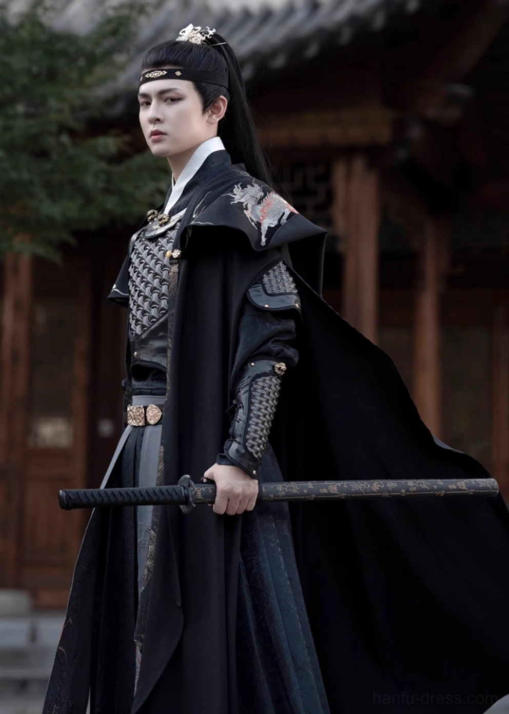 Black xianxia general hanfu armor costume for men shown in a left side full body view with black cloak, shoulder armor, gold waist belt, and sword