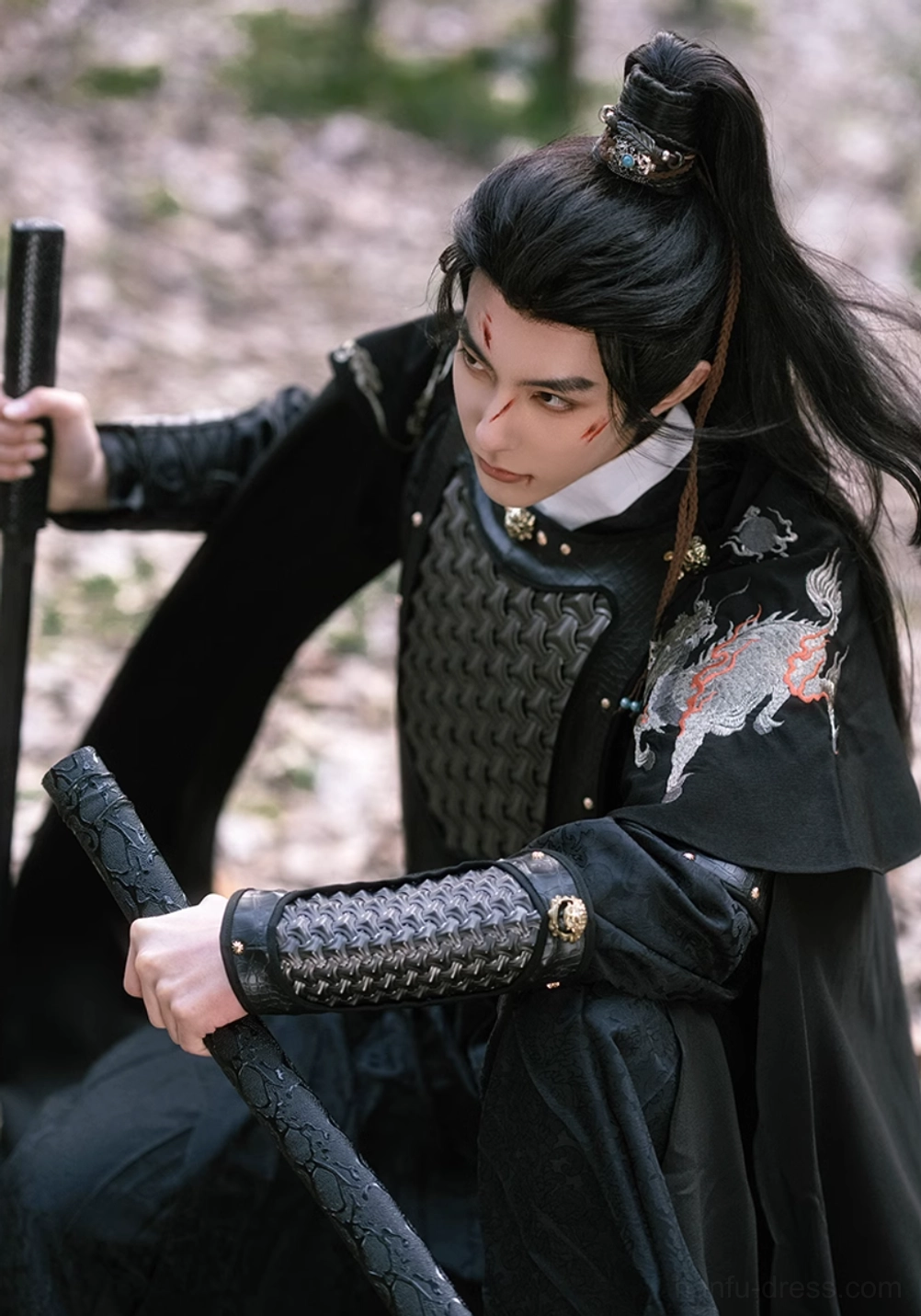Dynamic kneeling pose in black xianxia general hanfu armor set featuring black cape, embroidered robe, gold buckle arm armor, and warrior styling