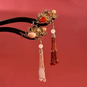Traditional Chinese hair stick designs with black wooden pins gold cloud ornaments and red or pink beaded tassels