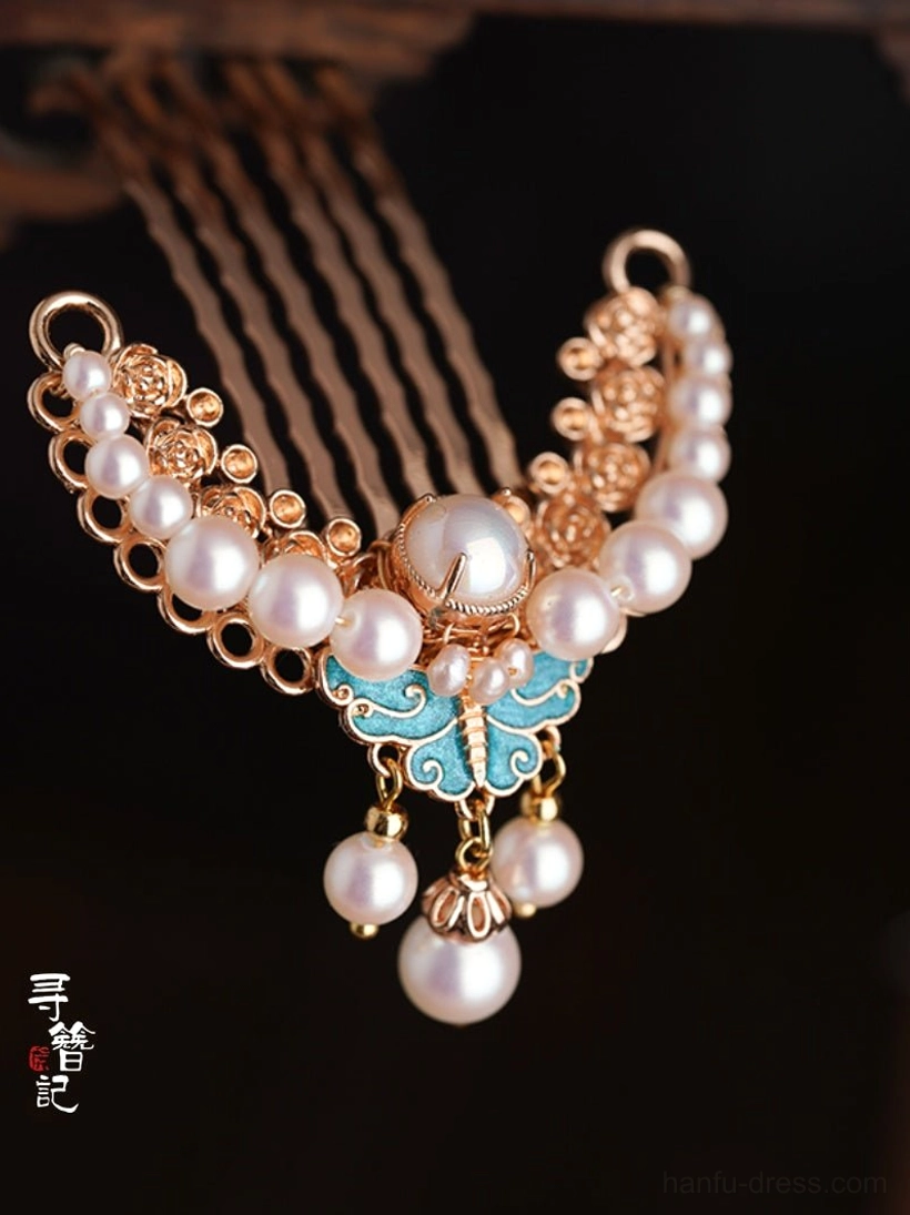 Close-up front view of blue butterfly Chinese hair comb pin with pearl-style bead clusters gold-tone filigree and dangling pearl tassels