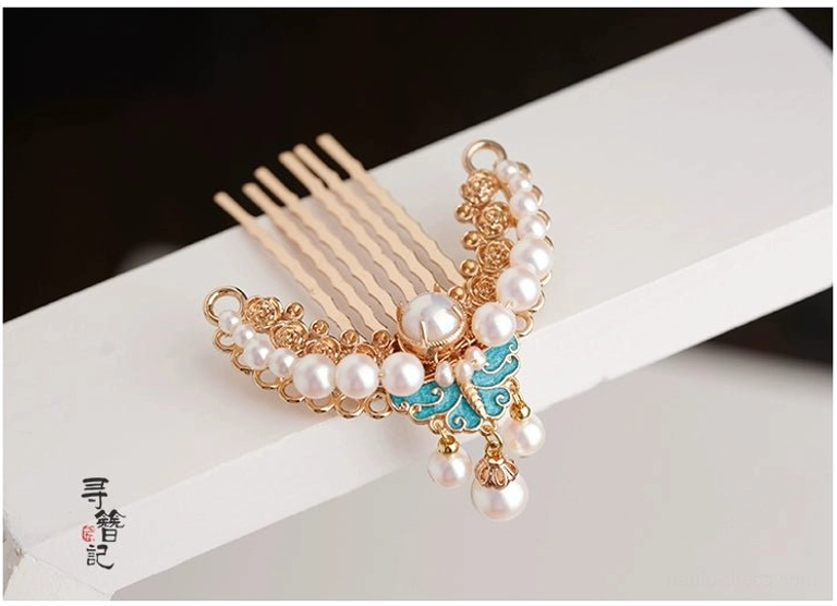 Blue butterfly and pearl Chinese hair comb pin with gold-tone decorative details and metal comb teeth shown from a right oblique view