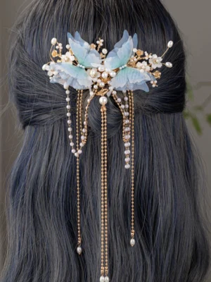Blue butterfly pearl tassel Hanfu back hair comb worn in long dark hair, featuring gold chains and delicate dangling bead ornaments