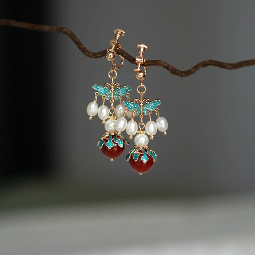 Simplified comfort clip-on blue cloisonne butterfly Chinese earrings with small pearl clusters and red agate drops