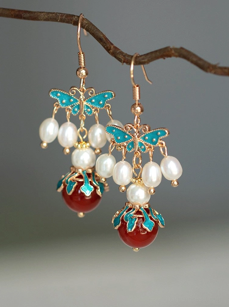 Gold hook blue cloisonne butterfly Chinese earrings with pearl tassel clusters and red agate drop detail