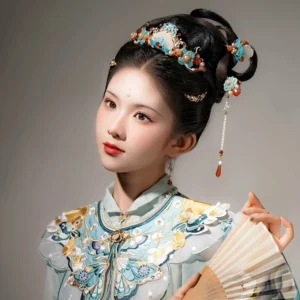 Model wearing a complete blue cloisonne Hanfu hair accessories set with red agate pearls gold-toned ornaments and dangling tassels