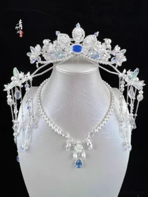 Chinese style fairy tiara and coordinating jewelry styling displayed on mannequin with blue gemstone floral crystals pearl details and dangling tassels