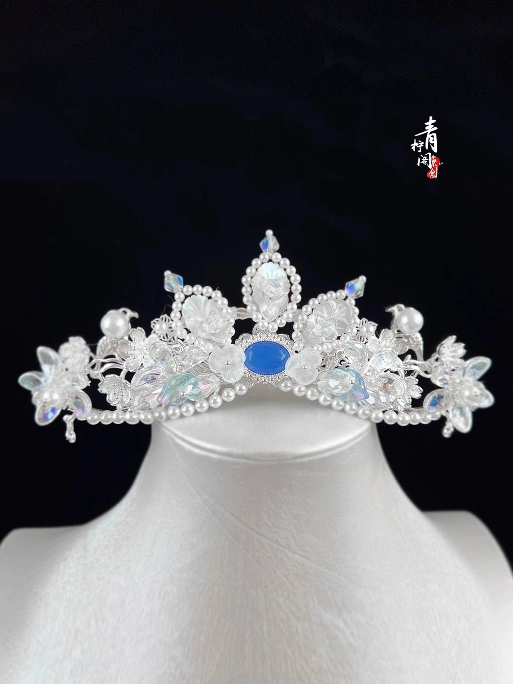 Blue crystal fairy tiara hanfu hair accessory displayed on mannequin head with silver tone floral ornaments faux pearls and iridescent crystal drops