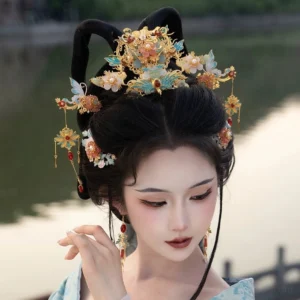 Blue enamel floral Hanfu hair accessory complete set worn with light blue traditional Chinese Hanfu by a lakeside