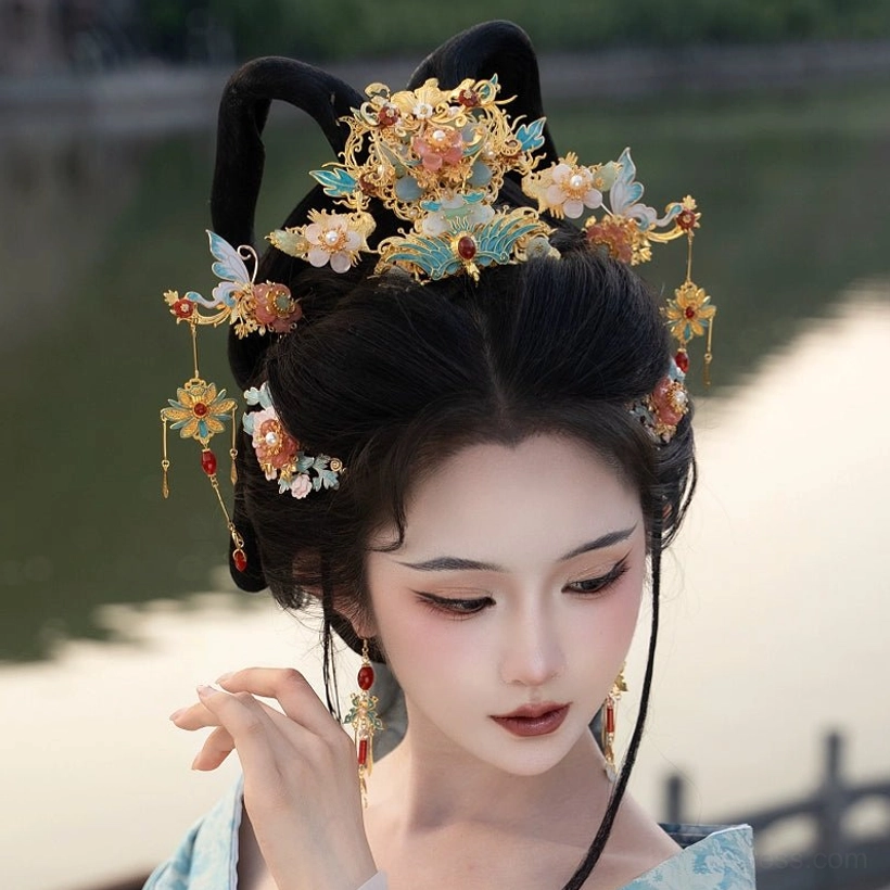 Blue enamel floral Hanfu hair accessory complete set worn with light blue traditional Chinese Hanfu by a lakeside