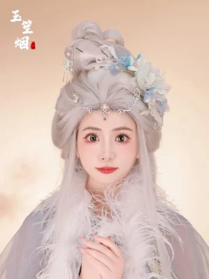 Blue feather Hanfu hair accessories set styled with a silver ancient Chinese wig, light blue and ivory Hanfu outfit, floral hair ornaments, pearl details, and rhinestone forehead chain