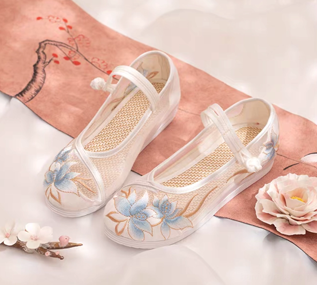 Women's traditional Chinese Hanfu shoes with white breathable mesh upper, blue and gold lotus embroidery, ankle buckle strap, and flexible rubber sole