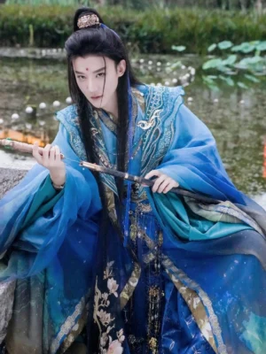 Close view of blue gradient male hanfu costume showing embroidered collar sheer sleeves cloud collar and tassel belt