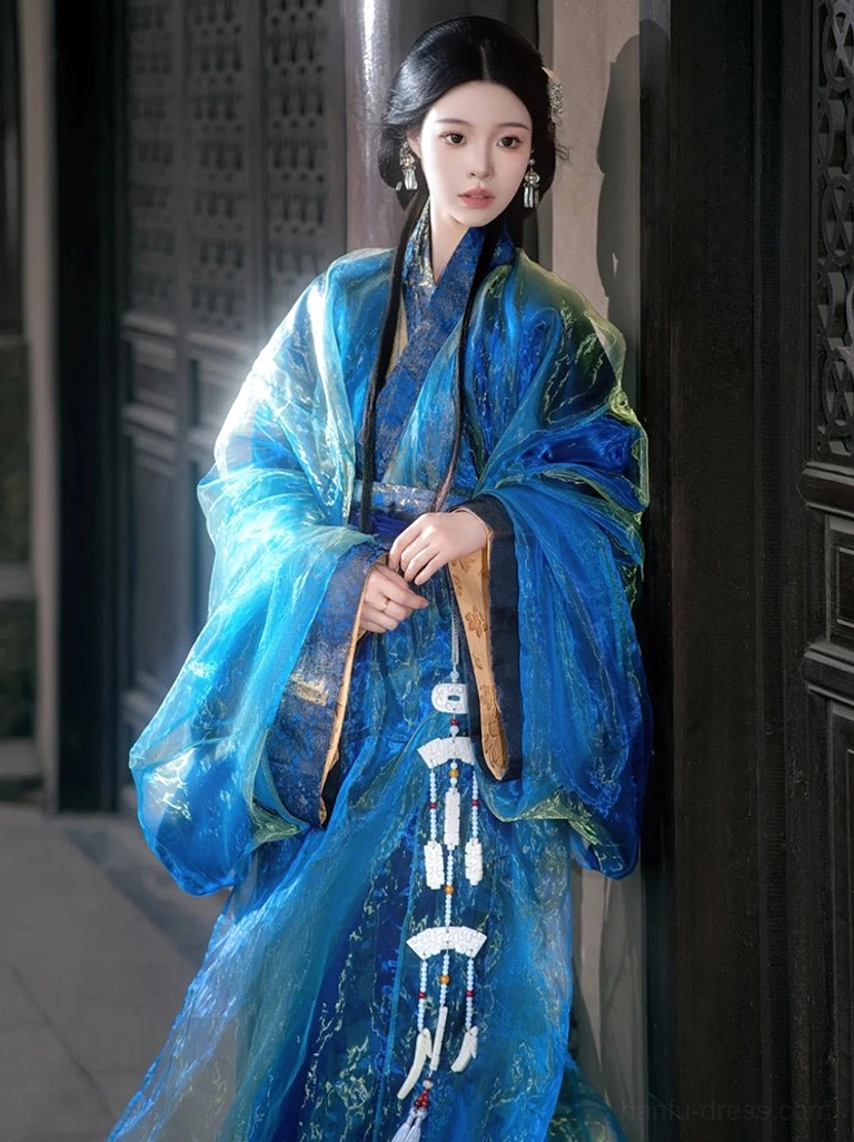 Half-body front view of a traditional blue Han Dynasty straight-hem Hanfu robe with shimmering fabric, gold-trimmed sleeve edges, and long white jade-style tassel accessories