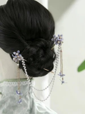 Blue hydrangea Hanfu back hair pin with pearl tassel chains and butterfly charms styled on a traditional Chinese hairstyle