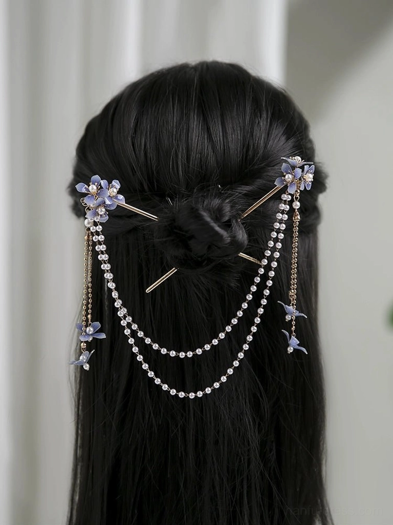 Blue hydrangea Hanfu hair pin with double pearl chain tassels secured in a long-haired low bun hairstyle
