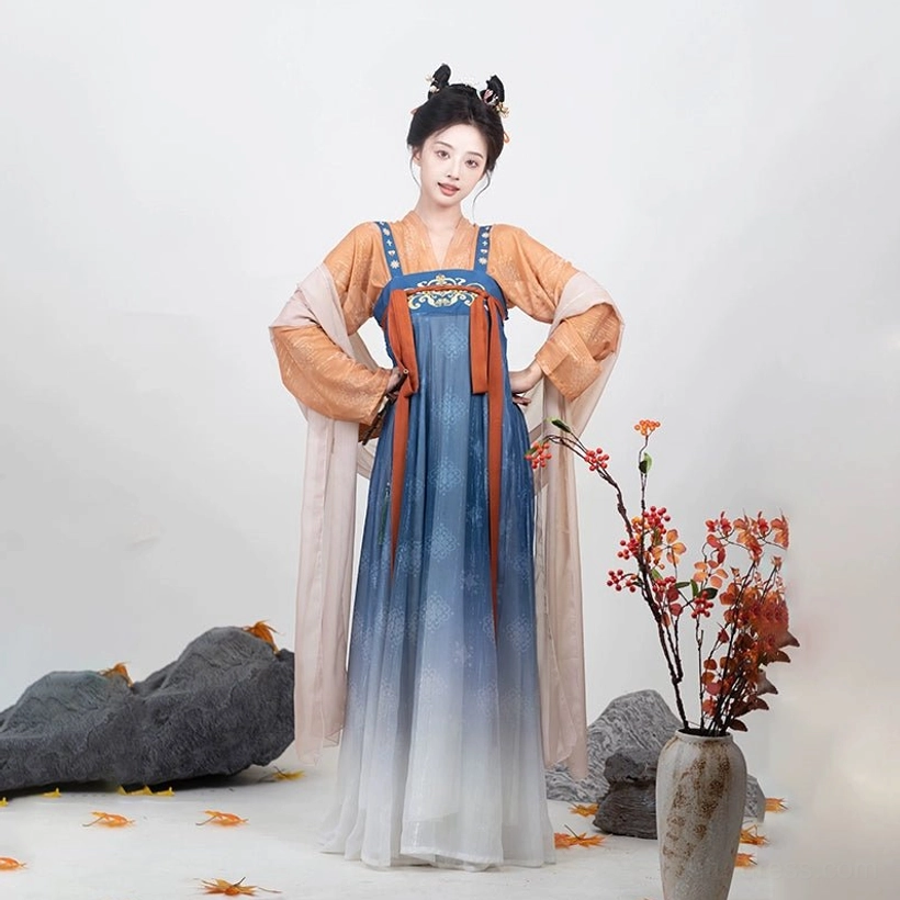 Side three-quarter view of blue and ivory gradient Tang Dynasty Qixiong Ruqun Hanfu with embroidered chest decoration and pink shawl