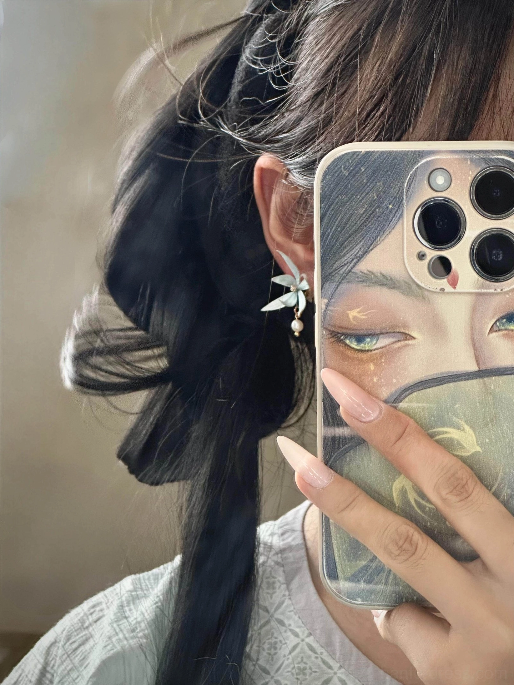 Blue orchid pearl drop Hanfu earrings worn by a woman with a traditional Chinese hairstyle for an elegant classical style look