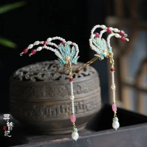 Side view of blue phoenix Chinese hairpins with gold-tone metal, pink beads and dangling pearl tassels