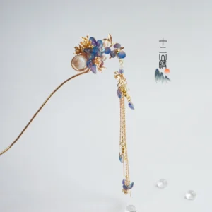 Front view of gold tone Chinese Hanfu hair stick with blue purple flower beads and layered chain tassel