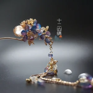 Blue purple floral tassel Hanfu hairpin with gold tone metal frame and pearl-like centerpiece on dark grey background