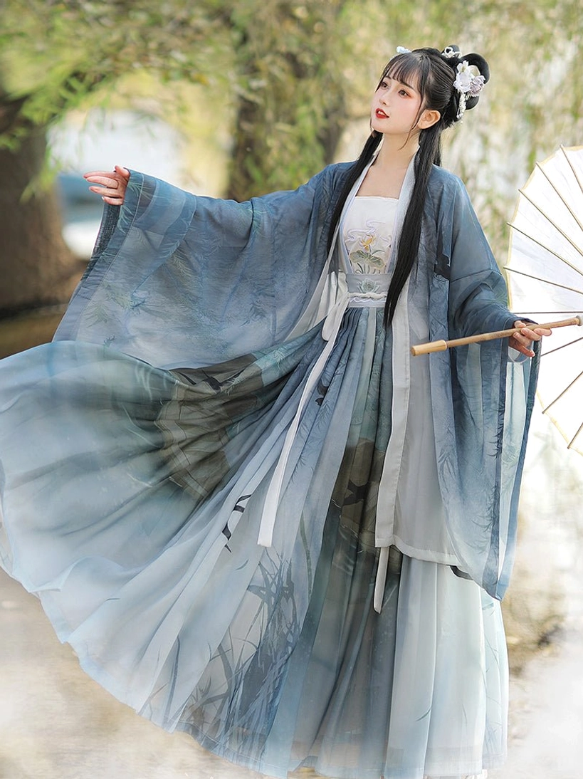 Blue Swallow Flight Qiyao Ruqun Hanfu with blue to light-cyan gradient chiffon, embroidered inner breast panel, reed and swallow prints, wide sleeves, and oiled paper umbrella