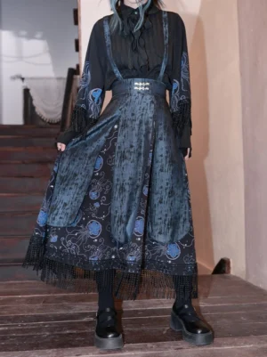 Back three-quarter view of high-waisted Blue Tears modern Hanfu midi skirt with distressed dark blue panels, floral and jellyfish print, decorative waistband buckle, and black tassel hem