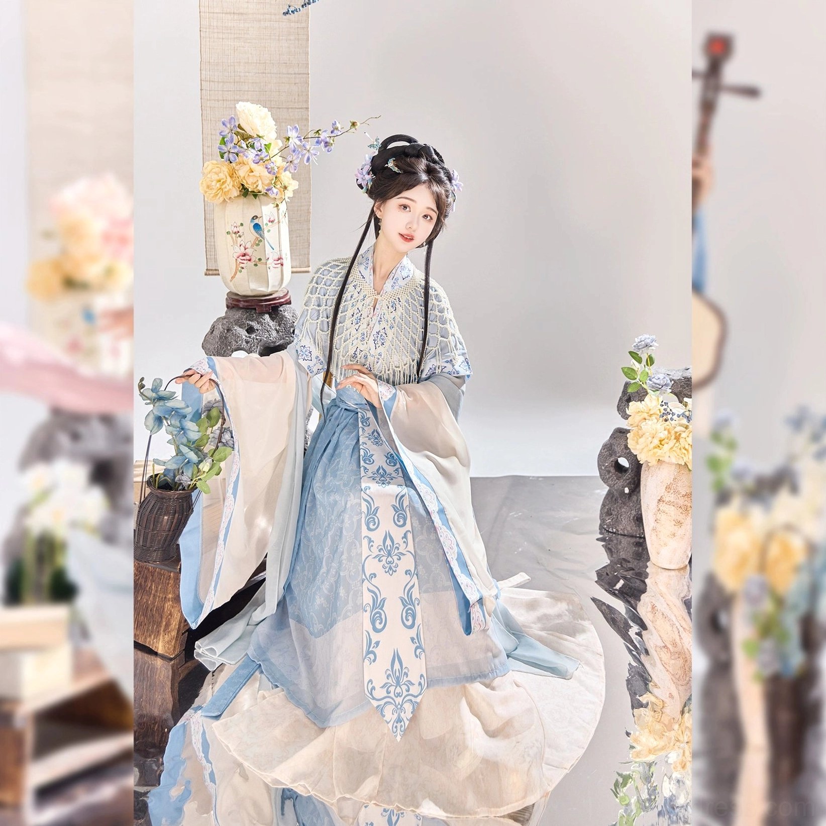 Blue Wei Jin Dynasty Qiyao Ruqun Hanfu shown from a side angle with floor-length flowing skirt, translucent sleeves, embroidered floral waist trim, and celestial Xianxia styling