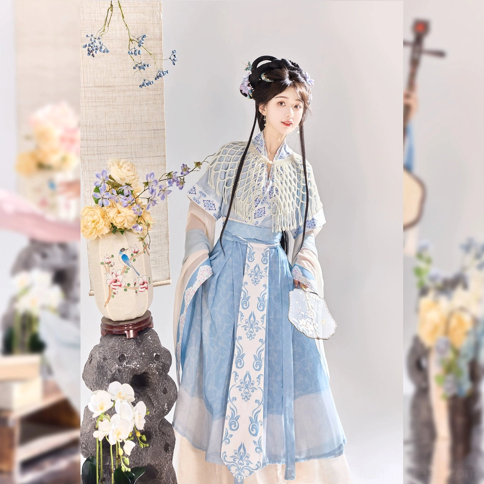 Blue Wei Jin Dynasty Qiyao Ruqun Hanfu dress with translucent wide sleeves, embroidered yoke, flowing blue layered skirt, floral waist ribbon, and ancient Chinese styling