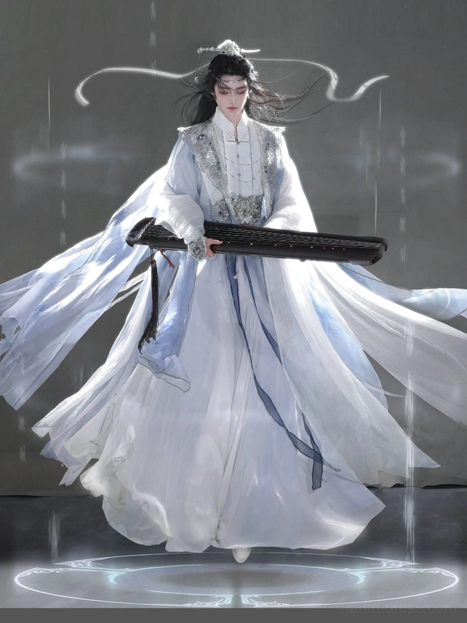 Full-body front view of a blue and white unisex Hanfu set with layered robes, flowing sleeves, pale blue accents, and a dramatic trailing train worn by a male model holding a guqin