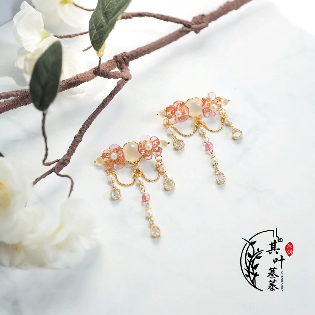 Pair of blush pink floral Hanfu side hair clips with gold tone frames and short dangling chain tassels for qipao and traditional Chinese hairstyles