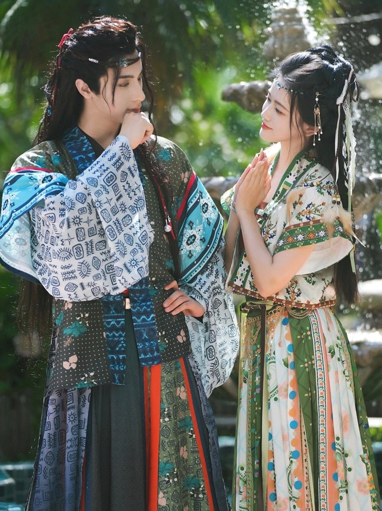 Romantic garden portrait of models wearing Bodhi matching ethnic-inspired hanfu clothing for couples