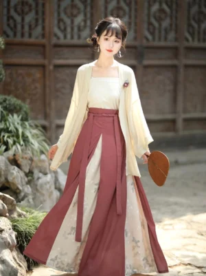 Brick modern Song Dynasty Hanfu three-piece set with beige wide-sleeve cardigan, white square-neck camisole, high-waisted layered wrapped skirt, and classical Chinese garden background